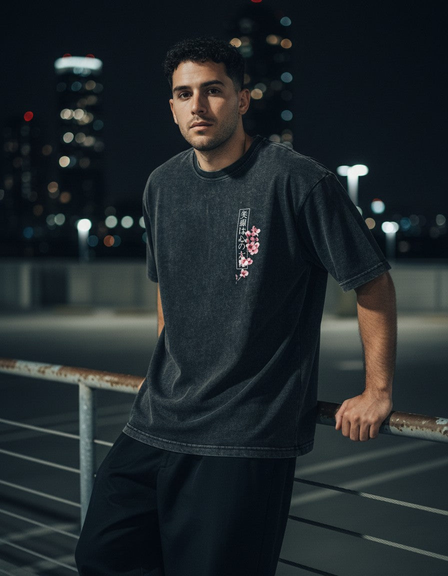 Man wearing the Koi Tomoe Washed Tee, night street lifestyle photo