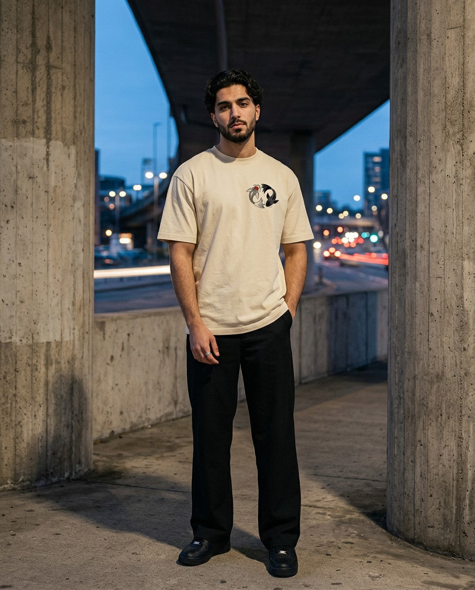 Man wearing the In-Yo Koi Tee, front view under a city overpass