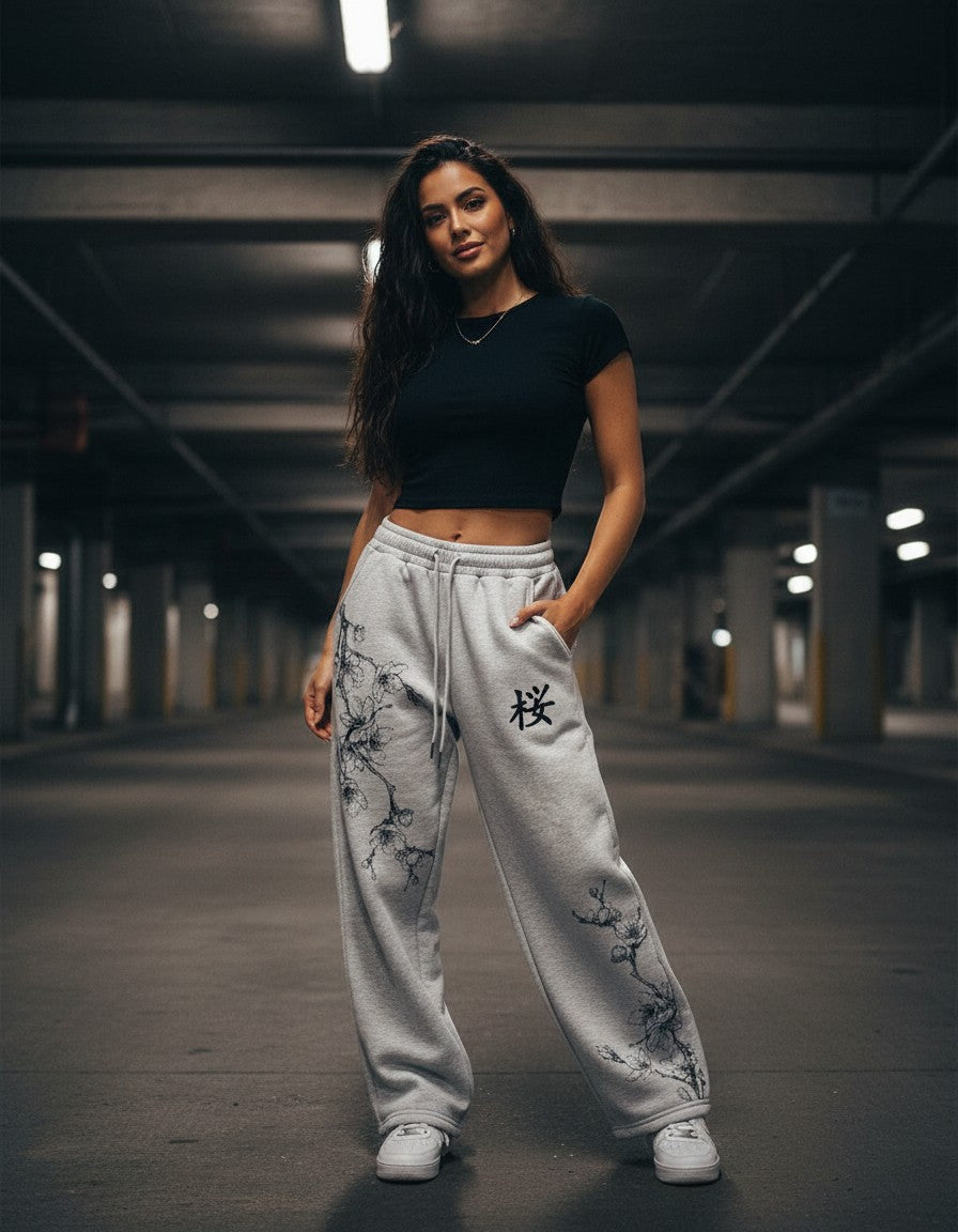 Woman wearing the Sakura Ink Sweatpants, night street lifestyle photo